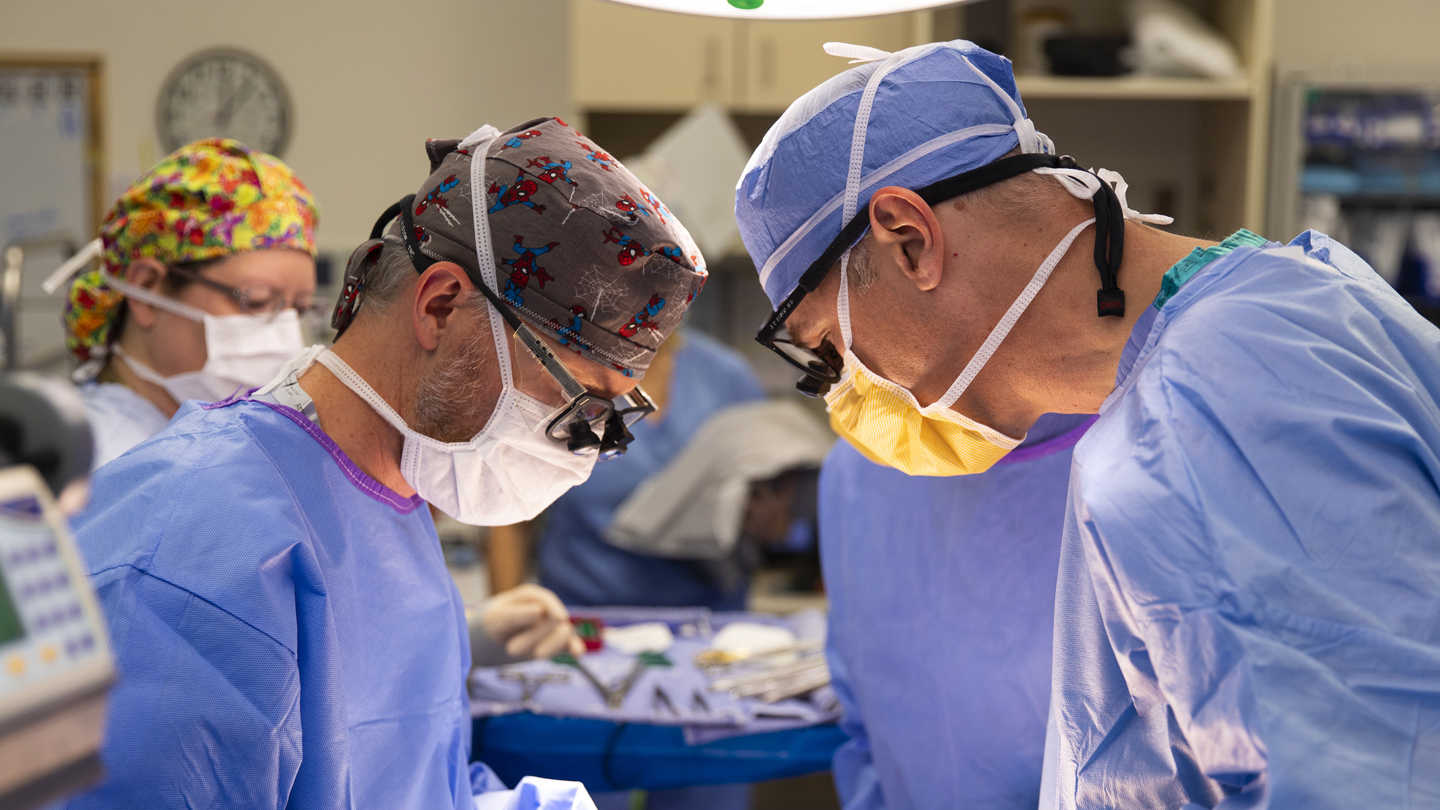 Dr. Nicholas Cost and Dr. Jonathan Roach perform surgery for the Surgical Oncology Program at Children's Hospital Colorado.