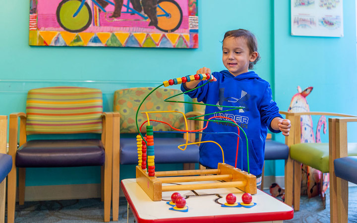 Patient playing in waiting room at Therapy Care, Broomfield