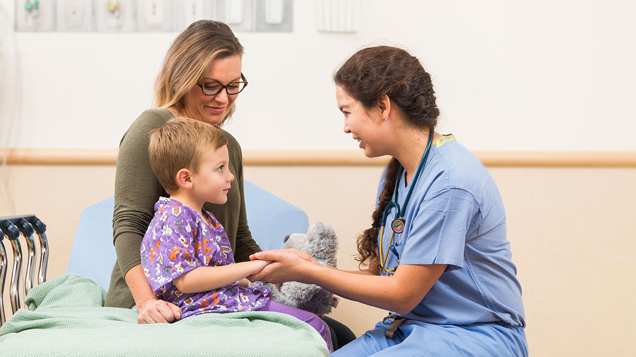 A nurse examines a child