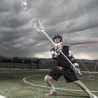 A lacrosse player catches the ball