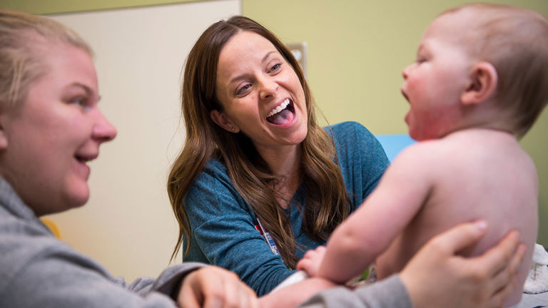 A nurse cares for a baby