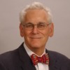 Headshot of Dr. Stephen Berman wearing glasses and a bowtie.